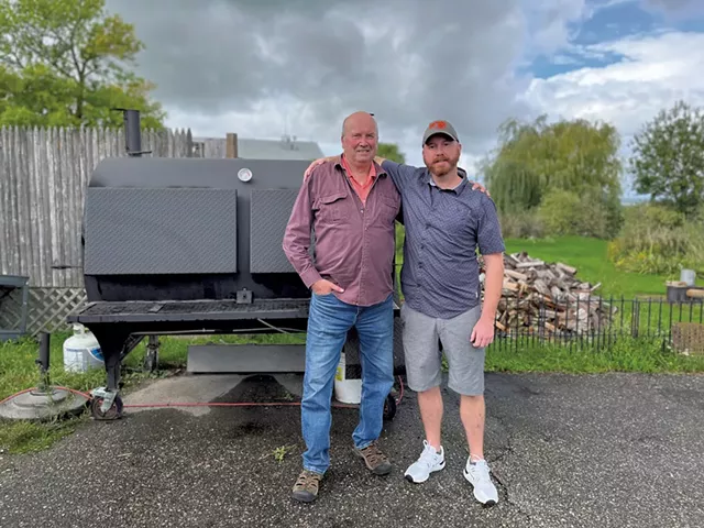 Herb (left) and Joe Glidden with their rotisserie smoker - JORDAN BARRY ©️ SEVEN DAYS