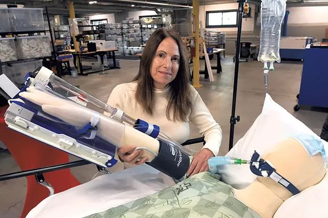 Dr. Marie Pavini showing off Healthy Design's Exersides Refraint System - JON OLENDER