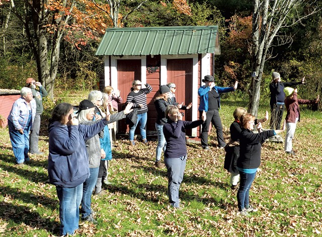 Students practicing mirror signaling at an outdoor survival skills workshop - COURTESY OF GRAYDON B. STEVENS