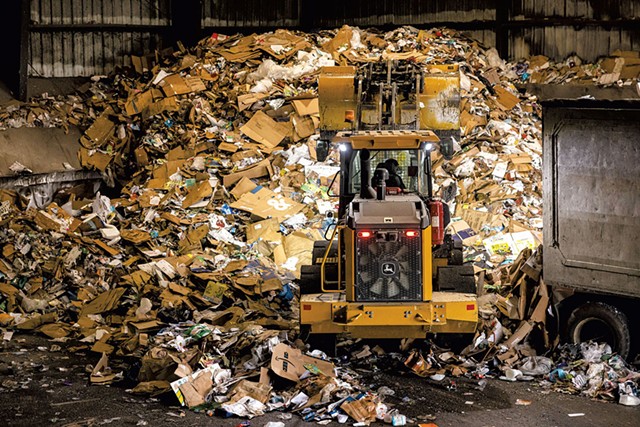 A machine moving recyclables at a Chittenden Solid Waste District facility in Williston - OLIVER PARINI