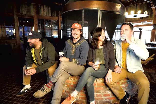 From left: Justin Maturo, Travis Charlow, and Chrystal and Brian Holt by the mill's round fireplace - DAVID SHAW