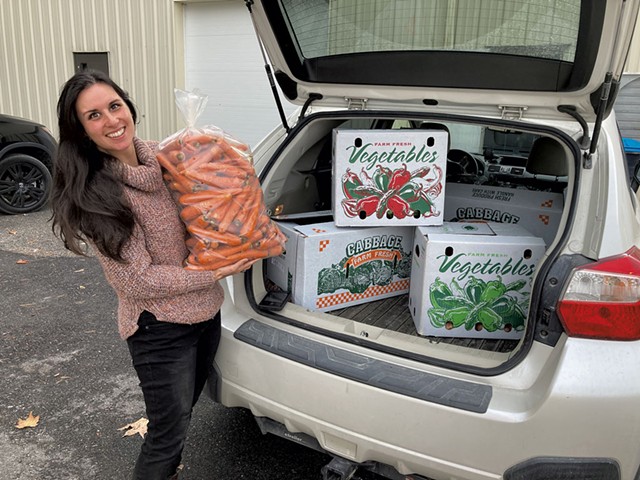 ACORN Food Hub manager Jessica Purks with an order of local produce for Bobcat Caf&eacute; &amp; Brewery - COURTESY
