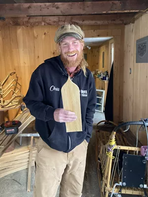 Chris Cleary with a Champ cedar shingle - SALLY POLLAK ©️ SEVEN DAYS