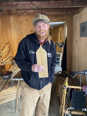 Chris Cleary with a  Champ cedar shingle - SALLY POLLAK ©️ SEVEN DAYS