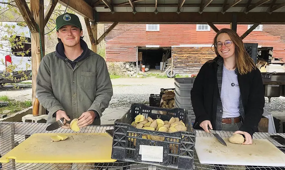 Cam Farwell and Ashley in the wash station prepping potatoes to plant - COURTESY