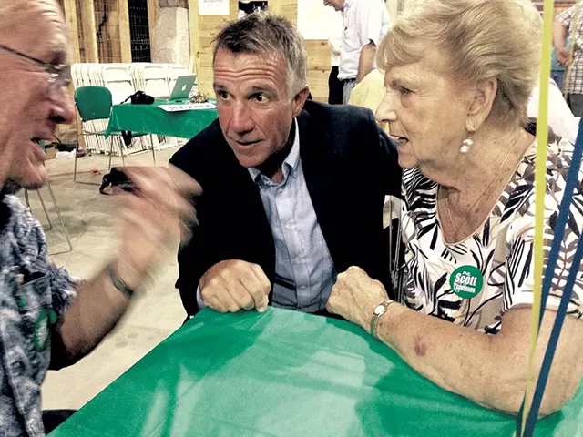 Phil Scott talking with Homer and Margaret Fitts of Barre - MOLLY WALSH