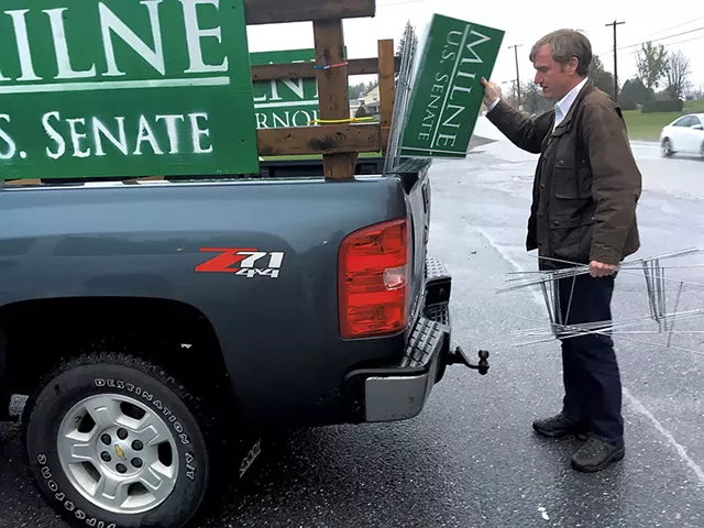 Scott Milne unloading campaign signs at a diner in Pittsford - MARK DAVIS