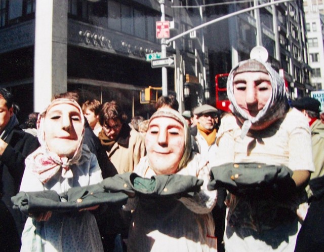Llu Mulvaney-Stanak (left) with parents Joelen Mulvaney and Ed Stanak as Bread and Puppet Theater washerwomen in a 2002 New York City parade against the Iraq war. - COURTESY PHOTO