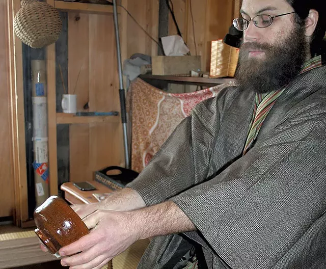 Ben Youngbaer doing a Japanese tea ceremony at Setting Sun Tea Hut - SUZANNE PODHAIZER