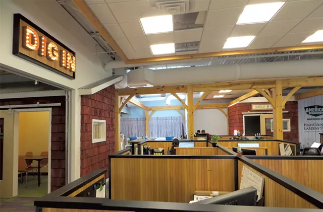 Desk space adjacent to a conference room at American Meadows - COURTESY OF AROCORDIS DESIGN