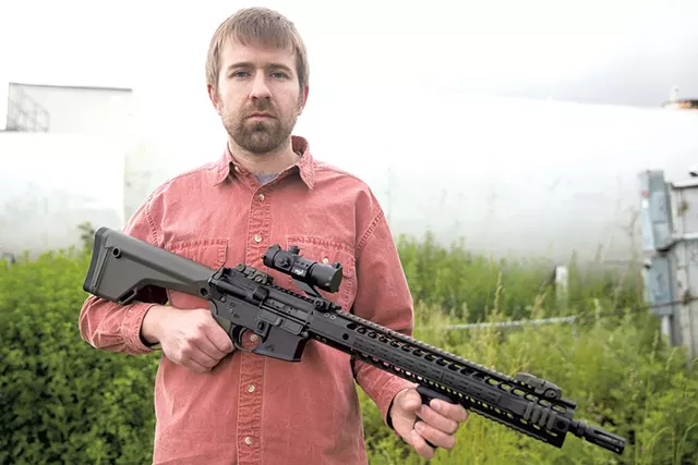 Paul Heintz with the AR-15 - FILE: JAMES BUCK