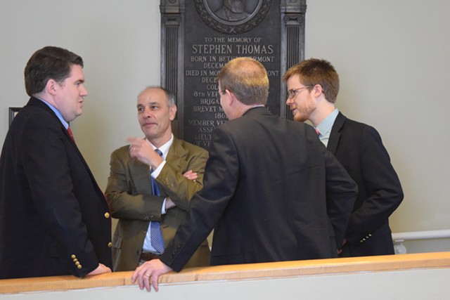 House Speaker Shap Smith, back to camera, confers with Reps. Oliver Olsen, left, and Adam Greshin, and Smith’s aide, Dylan Giambatista. - TERRI HALLENBECK