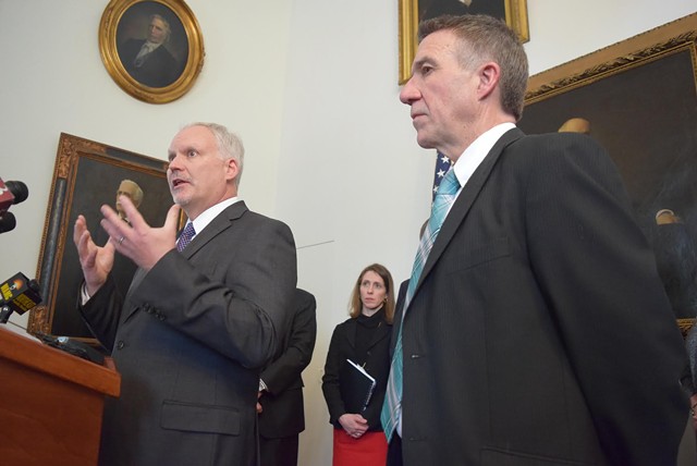 OneCare CEO Todd Moore addresses reporters Wednesday with Gov. Phil Scott to his right. - TERRI HALLENBECK