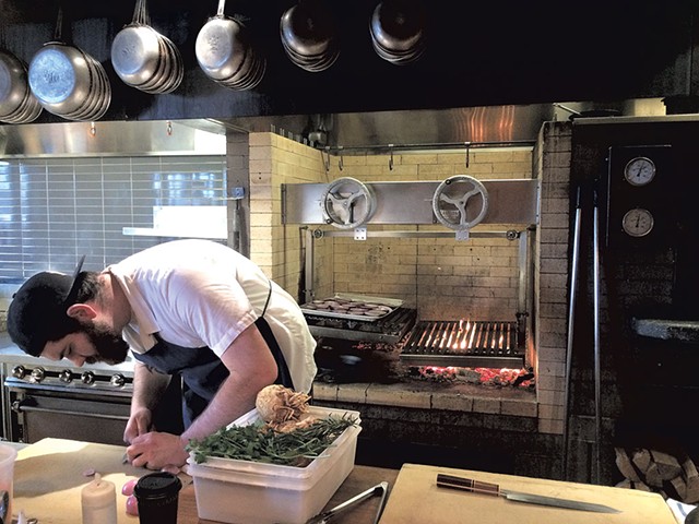 Avery Buck prepping for dinner service - SUZANNE PODHAIZER