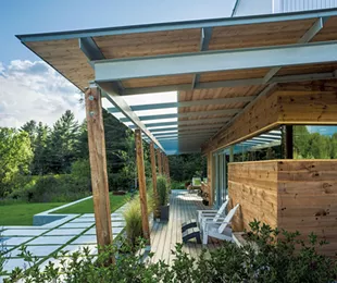 The outside deck showcases the home's floor-to-ceiling windows and doors. - JIM WESTPHALEN
