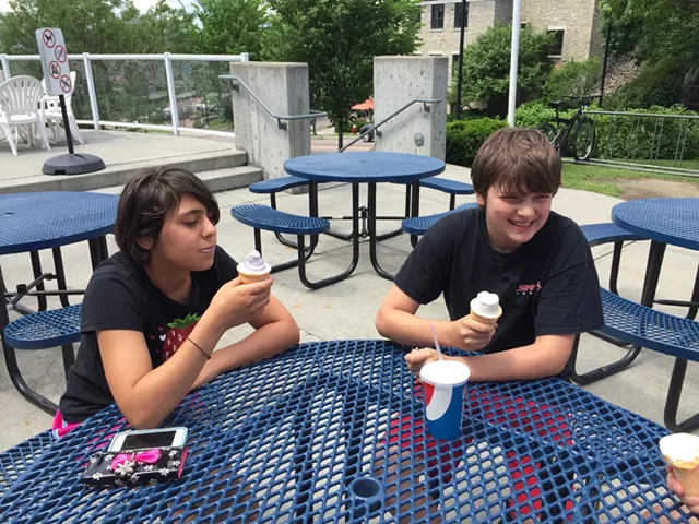 Savannah Werner and James Clancy of South Burlington eat creemees at Burlington Bay on the second day of summer vacation - SALLY POLLAK