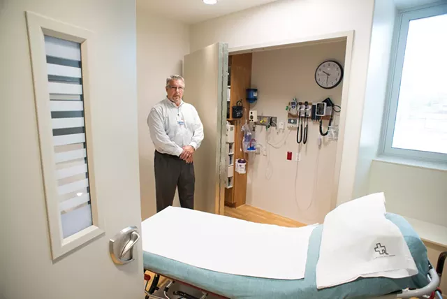 Emergency Department director Tom Rounds in a room outfitted for mental health patients at Rutland Regional Medical Center - CALEB KENNA