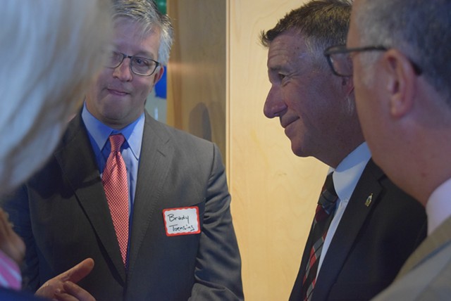 Vermont Republican Party vice chair Brady Toensing (left) and Gov. Phil Scott chatting with attendees - TERRI HALLENBECK