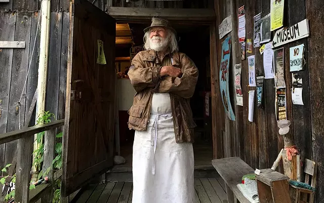 Peter Schumann at the entrance to the Bread and Puppet museum - SALLY POLLAK