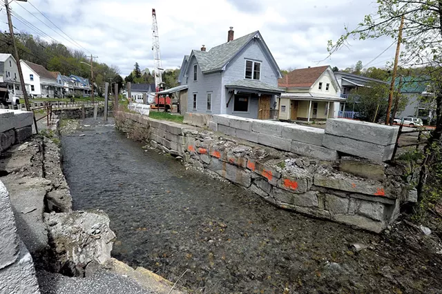 Flood-damaged homes and flood-control pylons in Gunners Brook in Barre - FILE: JEB WALLACE-BRODEUR
