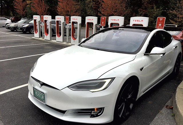 Tesla Supercharger station at Healthy Living Market &amp; Caf&eacute; - DAN BOLLES