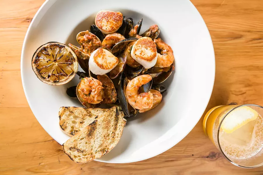 Cioppino and a Coladapin cocktail at Hatchet Tap and Table in Richmond - OLIVER PARINI