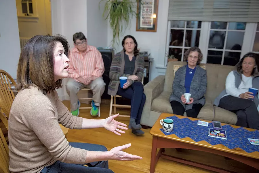 Carina Driscoll meeting community members at a house party - JAMES BUCK