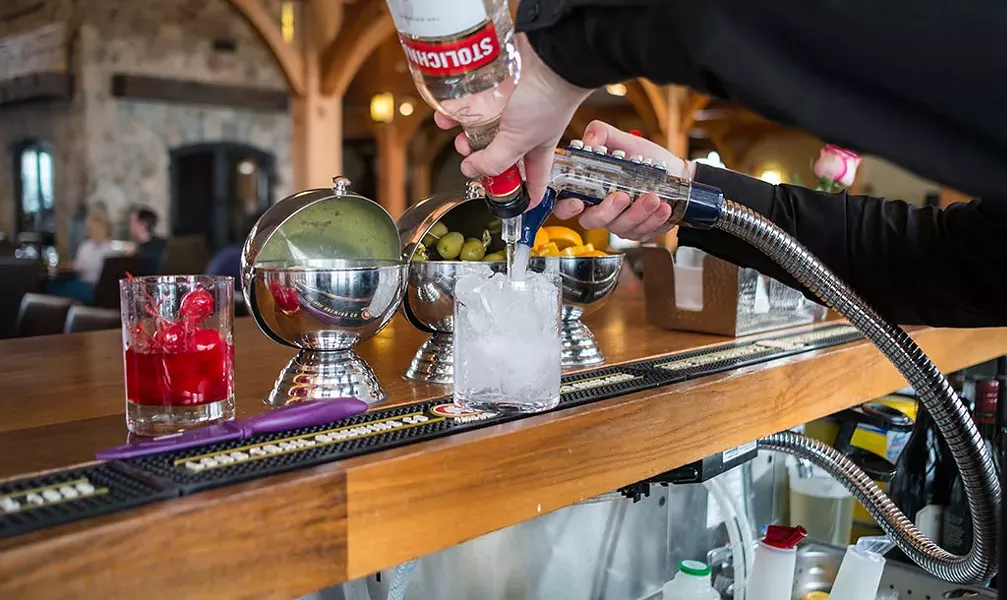Mixing a vodka tonic at the Hermitage Club in Wilmington - ZACHARY P. STEPHENS