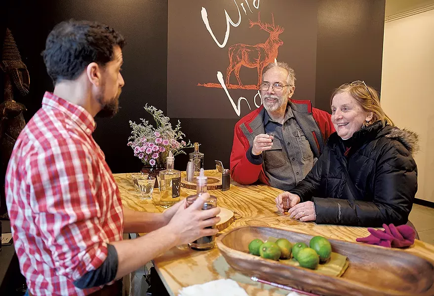 Craig Stevens (left) talking with customers - BEAR CIERI