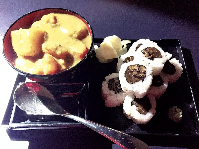 Curry and a sushi roll at Shinjuku Station Café - SALLY POLLAK