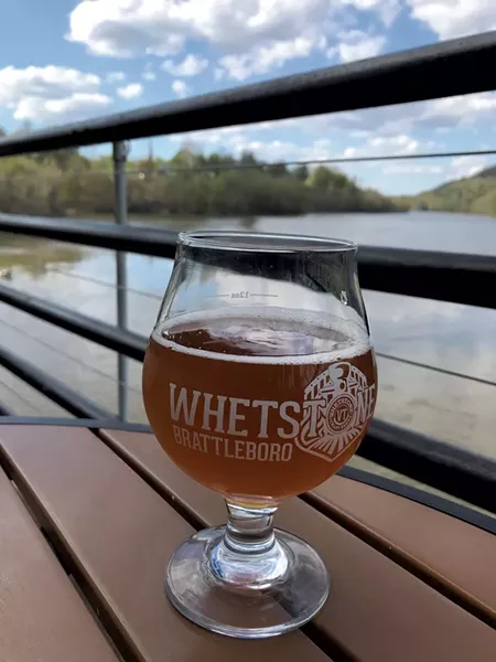 Beer on the patio overlooking the Connecticut River at Whetstone Station in Brattleboro - SALLY POLLAK