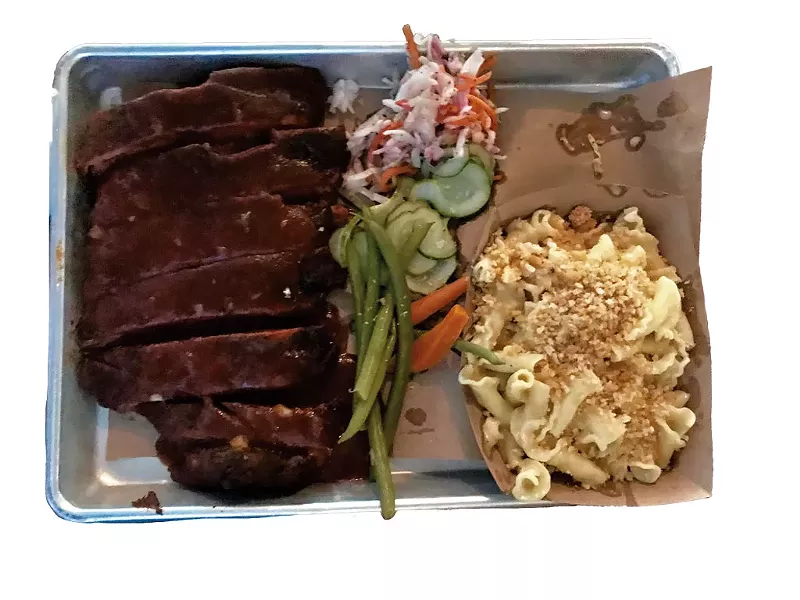 Pork ribs meal slathered in smoky barbecue at Black Diamond Barbeque - SALLY POLLAK