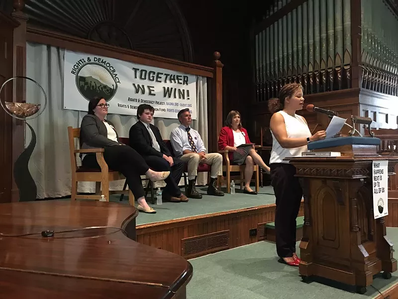 (Left to right): Gubernatorial candidates Brenda Siegel, Ethan Sonneborn, James Ehlers, and Chrstine Hallquist behind Tabitha Pohl-Moore of the Rutland Area NAACP. - JOHN WALTERS