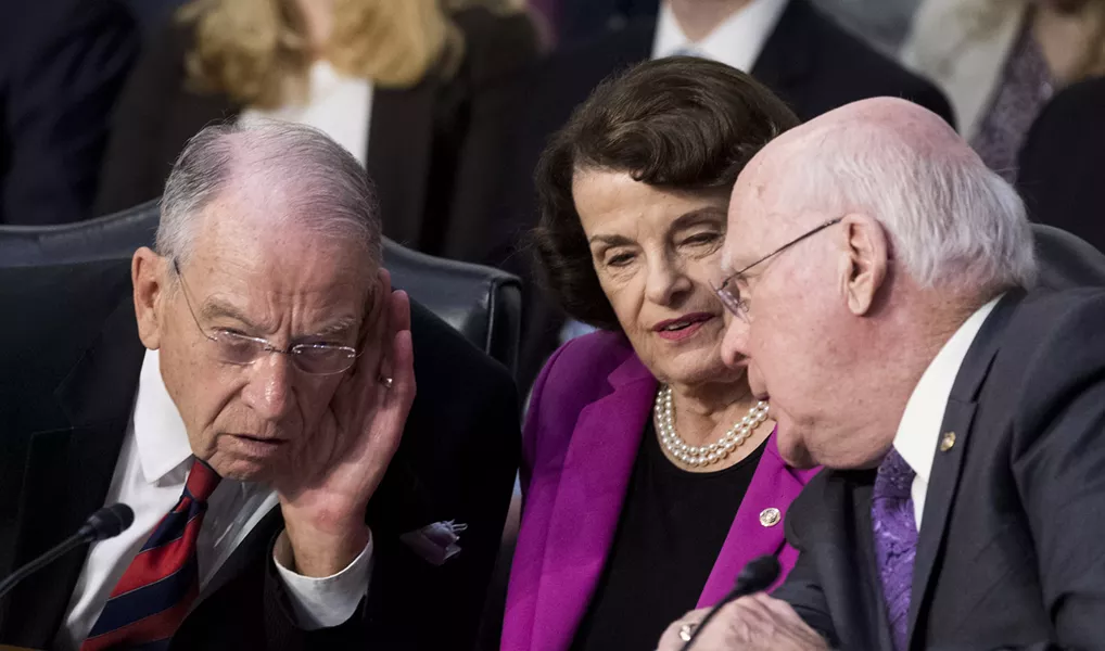 Sen. Chuck Grassley (R-Iowa) and Sen. Dianne Feinstein (D-Calif.) listen as Sen. Patrick Leahy (D-Vt.) speaks during the confirmation hearing of Brett Kavanaugh. - BILL CLARK/CQ ROLL CALL
