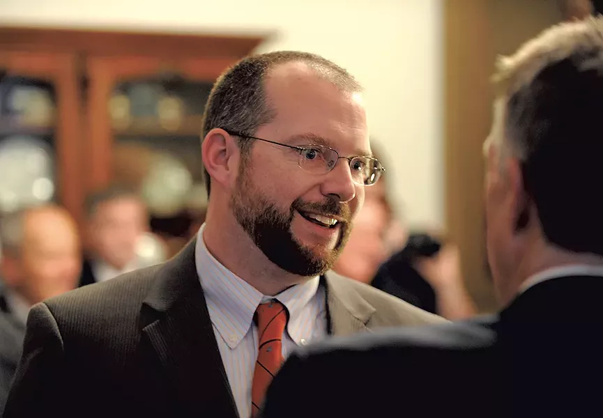 Jason Gibbs talking with Gov. Phil Scott - FILE: JEB WALLACE-BRODEUR