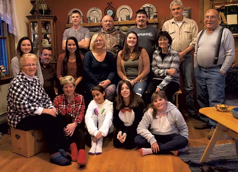 Davio family photo, Christmas 2017, with Jim (back row, second from left) surrounded by his family, including his mother, Jocelyn (front row, far left)