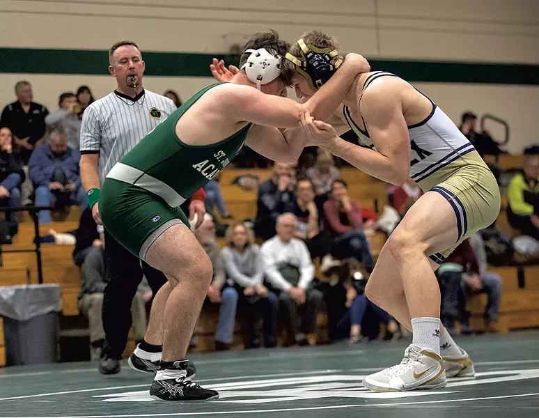 Ayman Alsalloumi (left) wrestling in a meet - JAMES BUCK