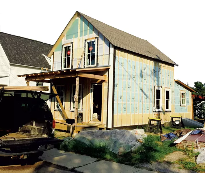 July 2015: The house is completely reframed and has new windows and doors. Exterior insulation is done. Trim is going on, and the house is nearly ready for siding. - COURTESY OF GRAHAM MACHARG
