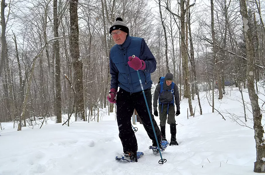Rep. Curt McCormack and his son, Jamie, snowshoeing up Camel's Hump - KEVIN MCCALLUM