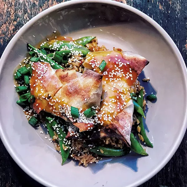 Pulled pork egg rolls with bacon, fried rice and snap peas - COURTESY OF CHIP NATVIG