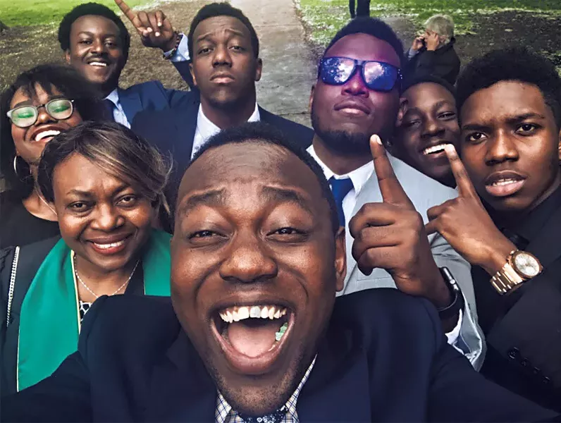 Beatrice Kambere (in green) with the Meli children and a nephew at Kambere's college graduation in 2018