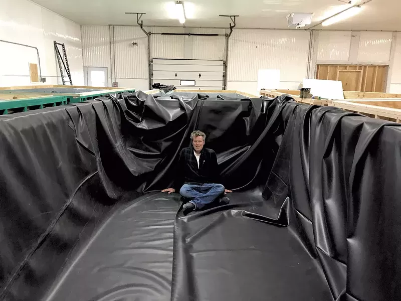 John Brawley of Sweet Sound Aquaculture in a shrimp tank - COURTESY OF JOHN BRAWLEY