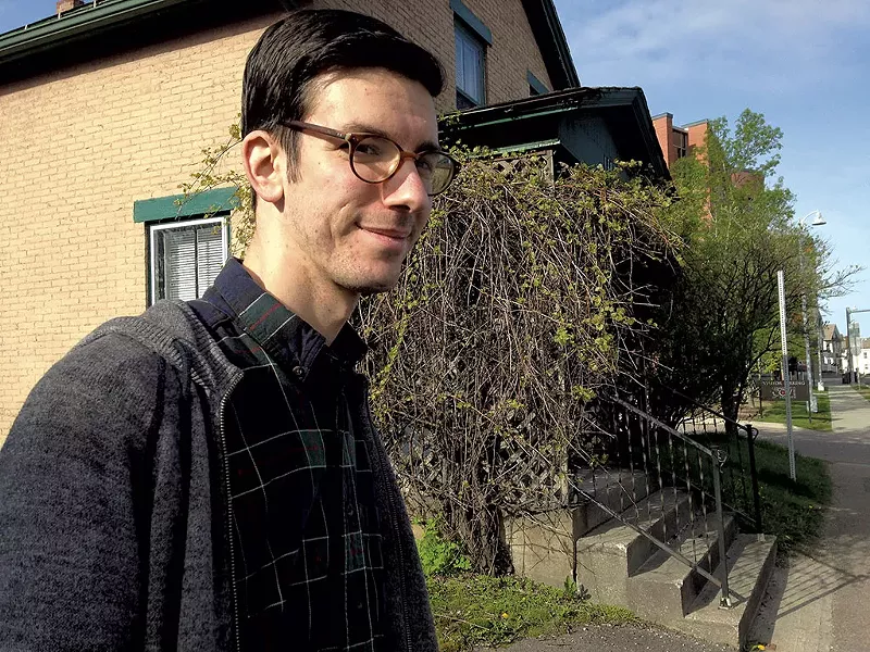 Joe Perron in front of an East Allen Street house that could be demolished - MOLLY WALSH