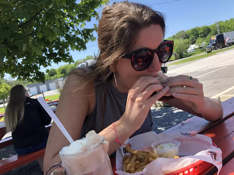 Diggin' into a black bean burger - SABINE POUX