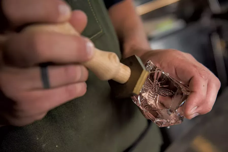 Beverage director Sam Nelis branding ice cubes - DARIA BISHOP