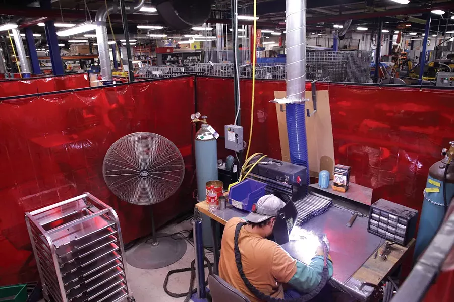 A worker at the Edlund Company - MATTHEW THORSEN