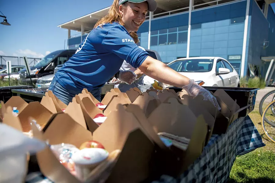 Free lunches outside the Community Sailing Center - JAMES BUCK