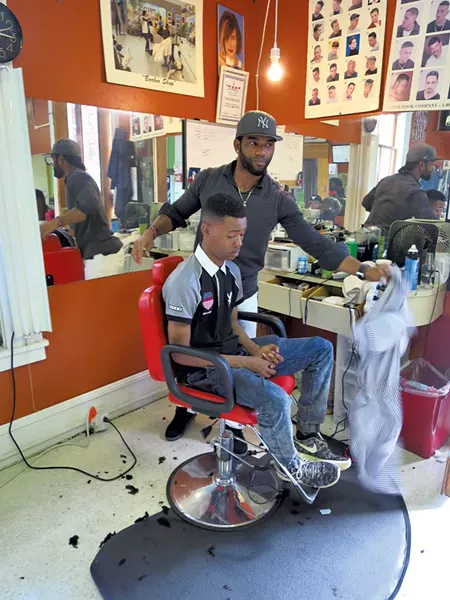 Algenis Garcia with a client - MATTHEW THORSEN
