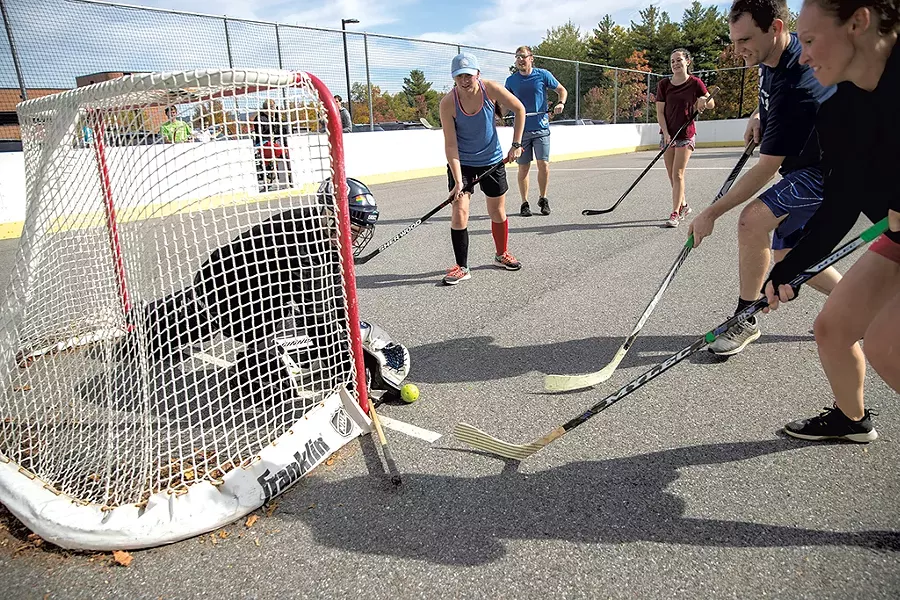 VIP employees playing street hockey - JAMES BUCK