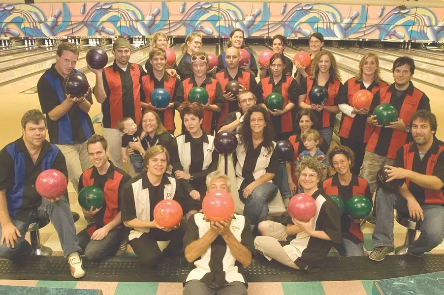 BACK ROW, FROM LEFT: Michelle “Mimi” Brown, Allison “Gutter Girl” Davis, Judy “Trixie” Beaulac, Jess “Sleazy” Campisi, Meghan “Evangeline Gutterball” Dewald. - PENULTIMATE ROW: Andy “MAV” Duback, Colby “Goldie” Roberts, Don “Dickie” Eggert, Diane “Reverend” Sullivan, Casey “Dark Lord” Rea, Emily “Soxy Lady” Peters, Haley “Betty” Mathis, Robyn “Sister Robyn” Birgisson, Steve “Cap’n Combover” Hadeka, Ken “K-Dog” Picard (seated). - SEATED, FROM LEFT: Rick “Rico!” Woods, Andrew “Spanky” Sawtell, Cathy “Crezmo” Resmer (and Graham), Michael “the Wiz” Bradshaw, Pamela “Pipi” Polston, Jonathan Bruce, Paula “P-Ro” Routly, Ruth “Cathy” Horowitz, Joanna “Rita” May (and Ben), Krystal Woodward. - FRONT AND CENTER: Matthew “Thor” Thorsen.